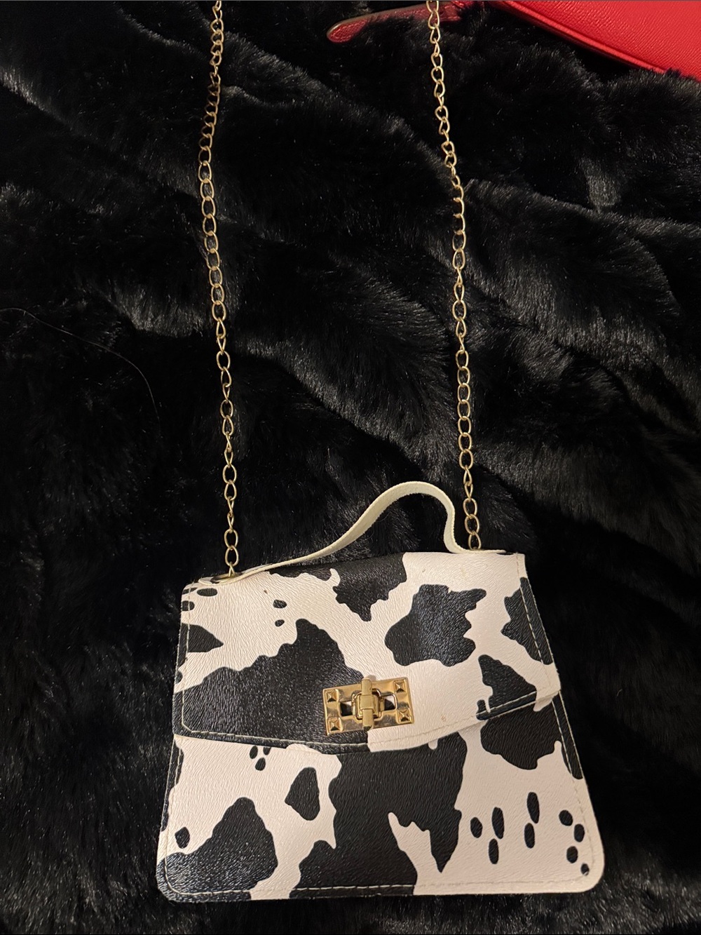 Black & White Cow-Print Crossbody Bag with Gold Chain